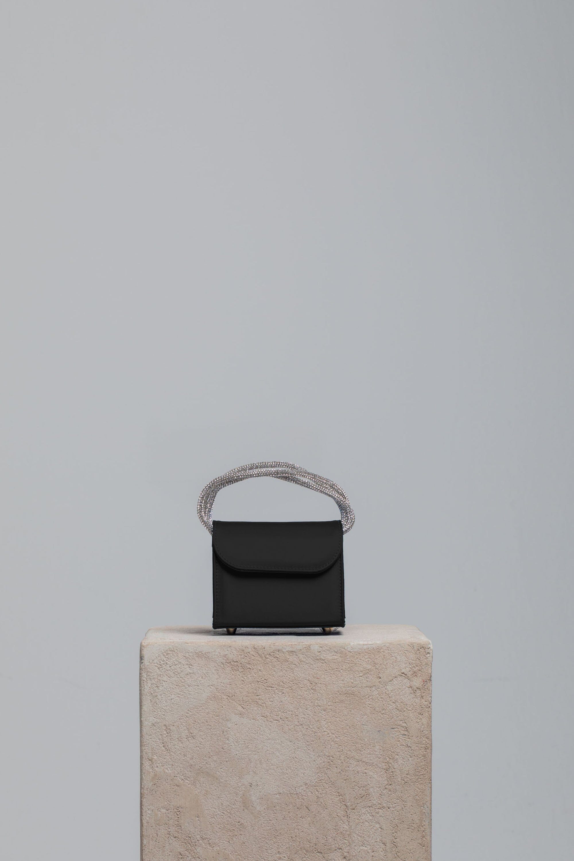Mini Loop Bag in Satin Handbags Folklore the label BLACK